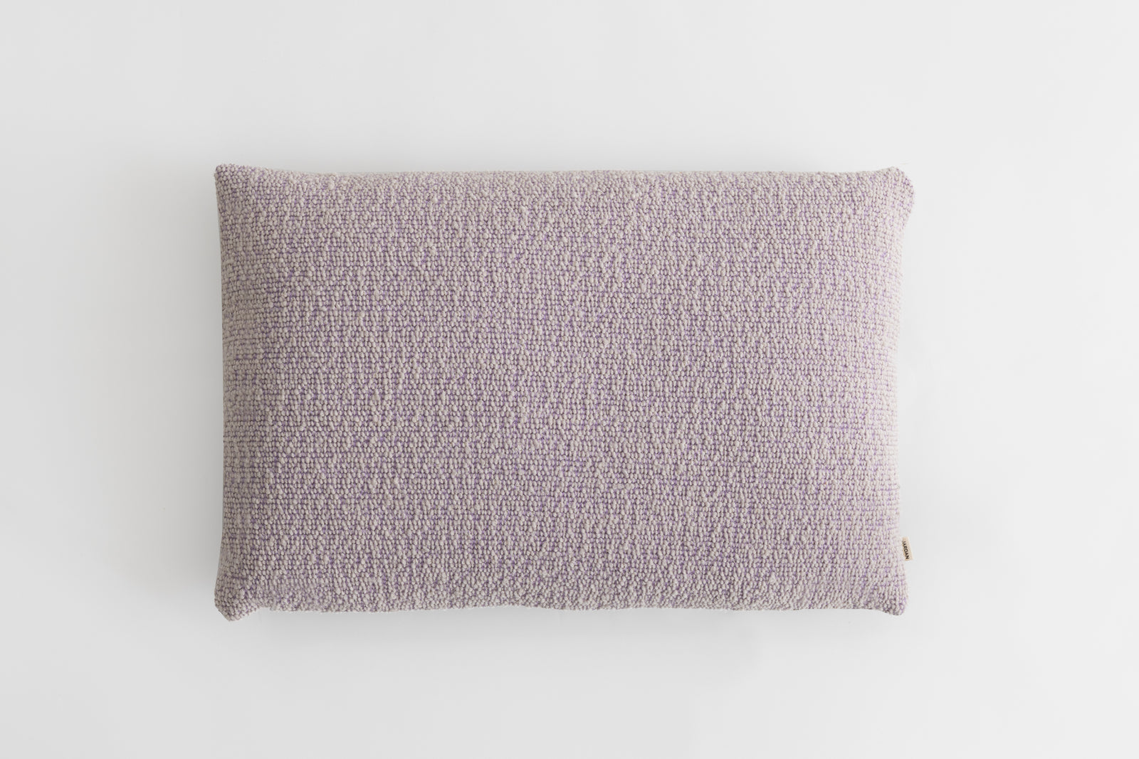 Bo is a reversible cushion with one side featuring our bowie fabric, a locally crafted boucle and the other side is contrasted with Duke, a premium linen. Available in a calming colourway of Crocus and Port.  